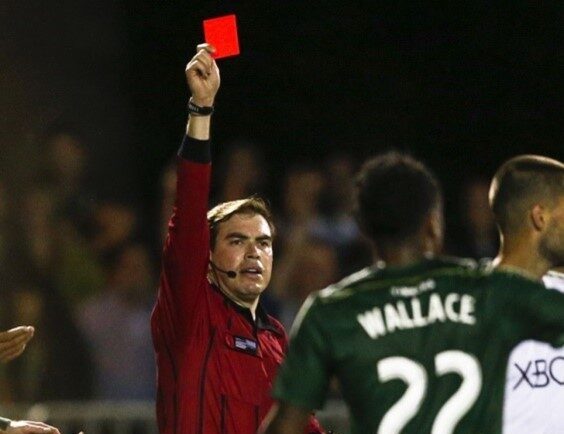 Daniel Radford issuing a red card during the match
